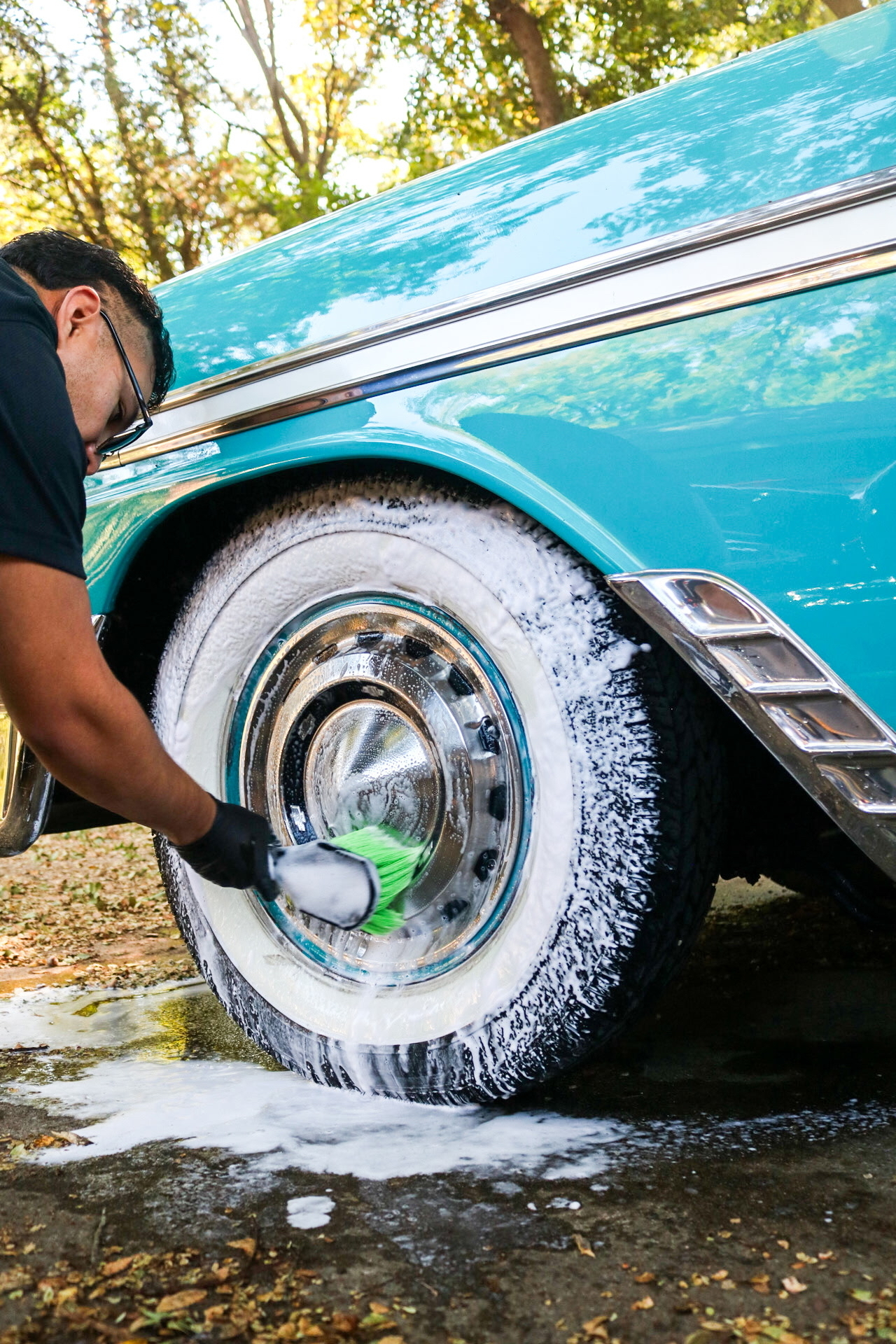 Close detail of a freshly cleaned whitewall tire and wheel.